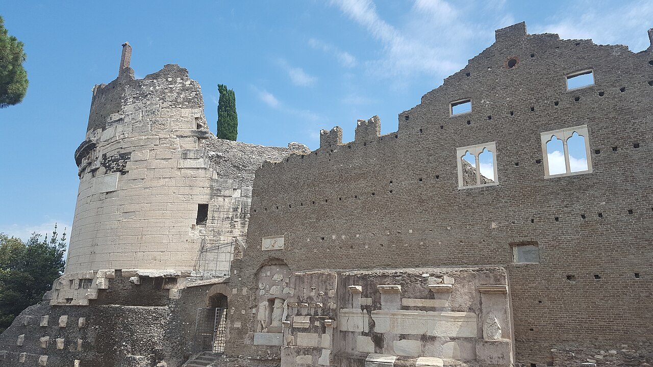 The round Tomb of Caecilia Metella with the battlemented castle walls built against it