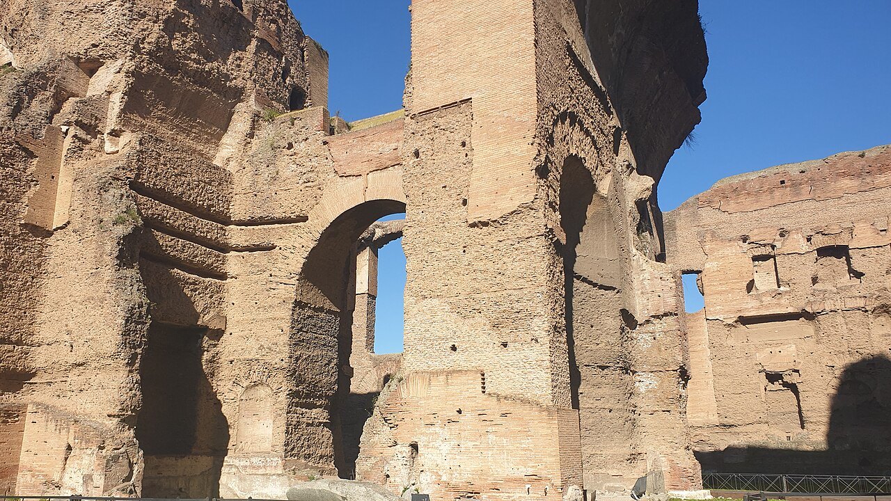 Tall brick walls and arches around the frigidarium of the Baths of Caracalla