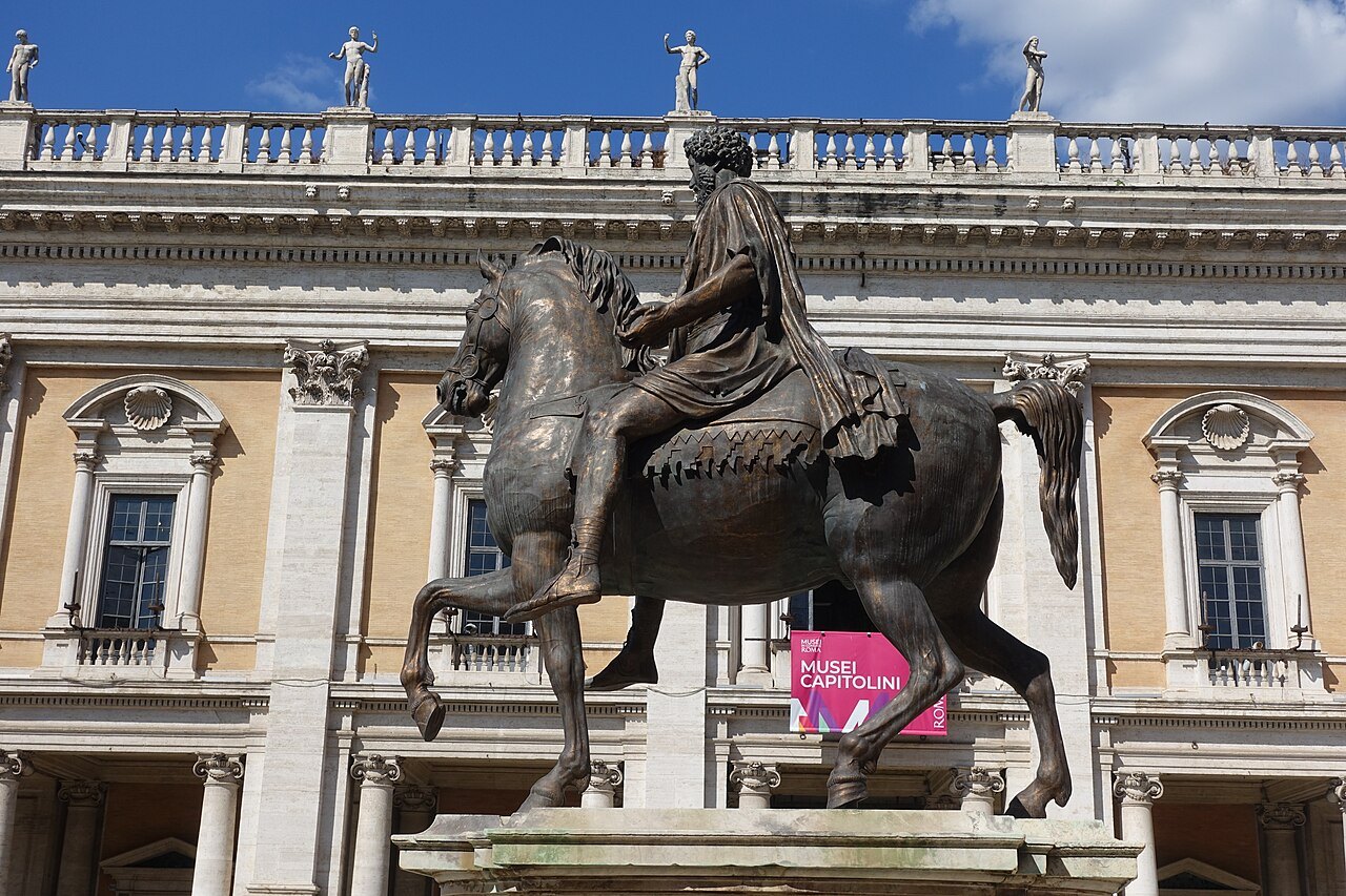 The bronze Marcus Aurelius in the Campidoglio, the Palazzo dei Conservatori behind him