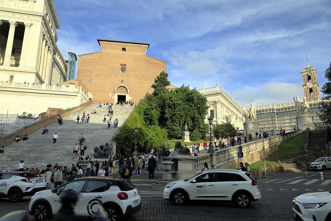 The steep stair of Santa Maria in Aracoeli beside the Cordonata, traffic in the square below