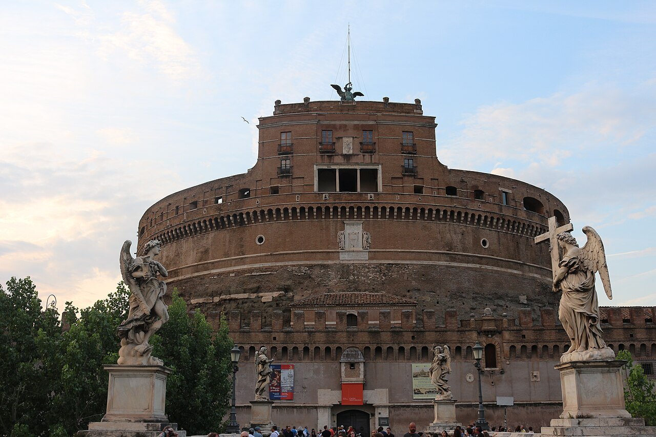 The front of Castel Sant'Angelo between two of Bernini's angels on the bridge
