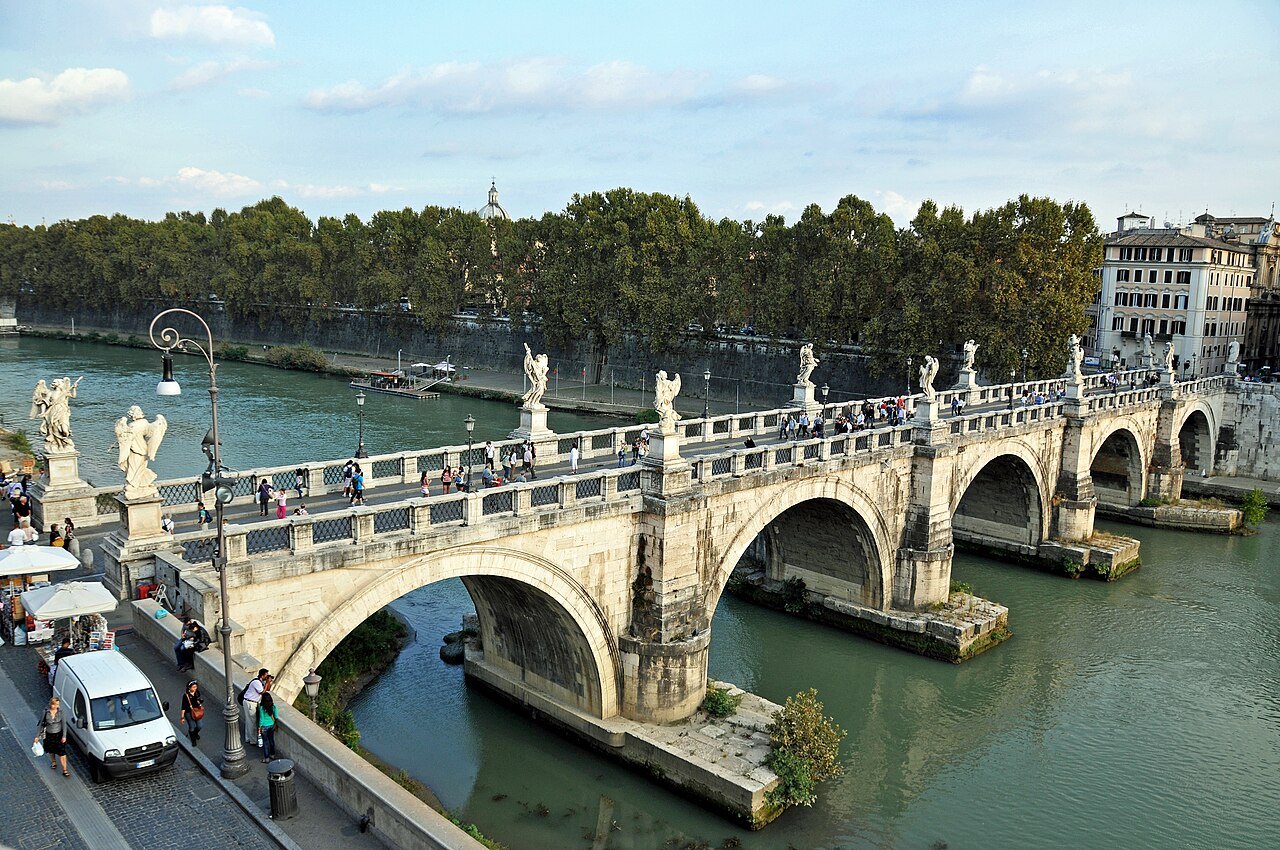 The Ponte Sant'Angelo and its row of angels from above, the Tiber curving away beyond