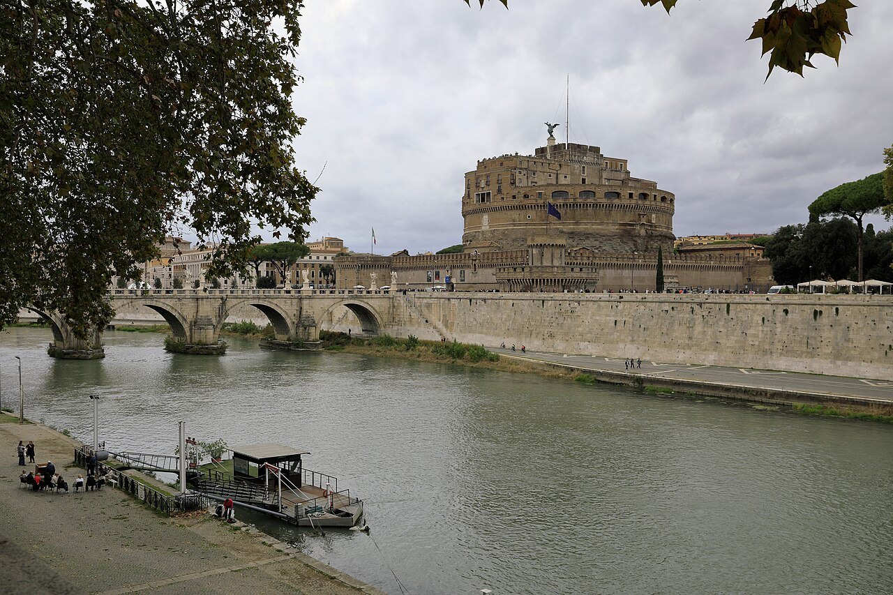 Castel Sant'Angelo and its bridge above the Tiber, a boat moored below