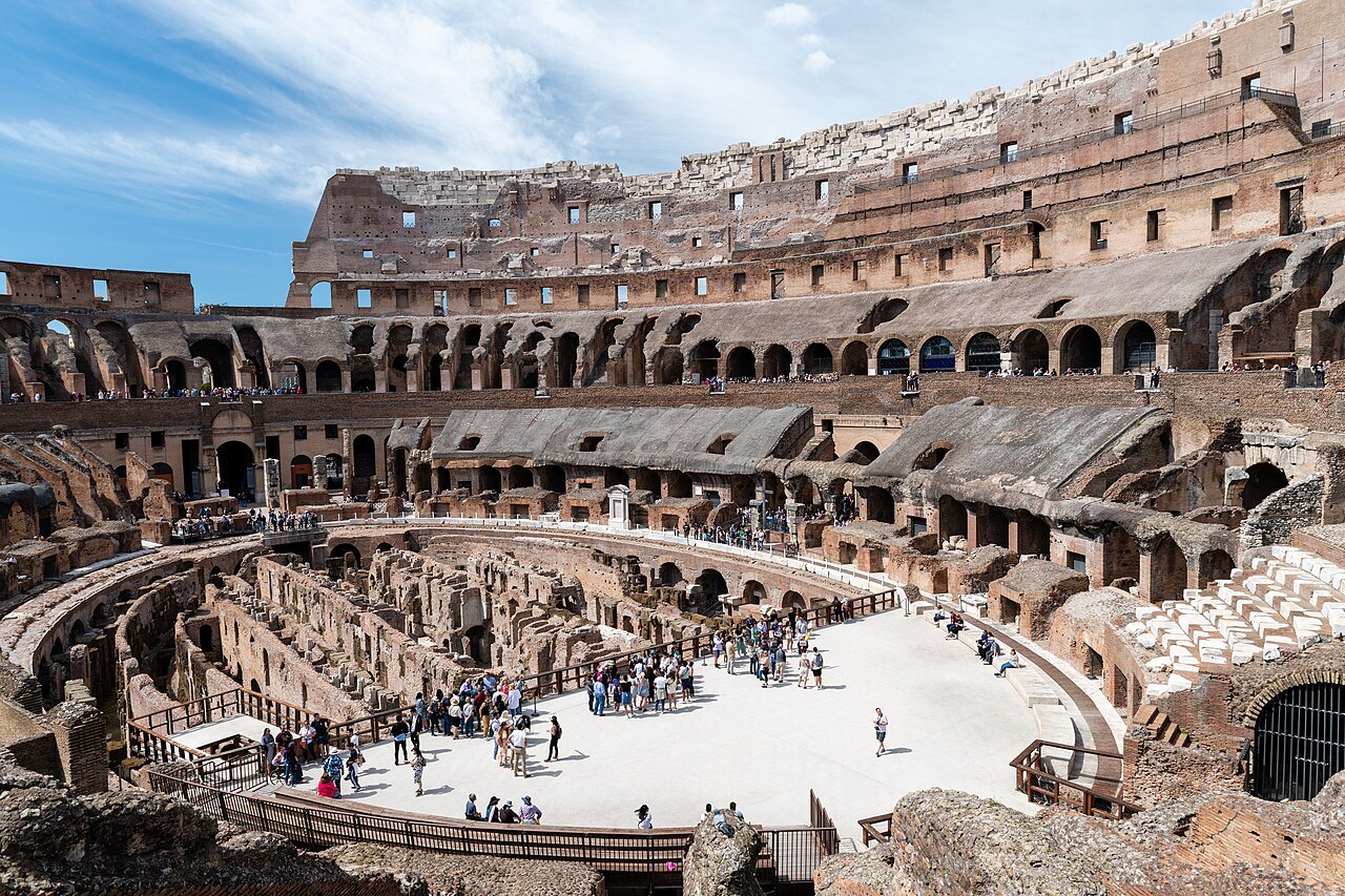 The arena of the Colosseum with its rebuilt floor, the underground walls and the tiers around it