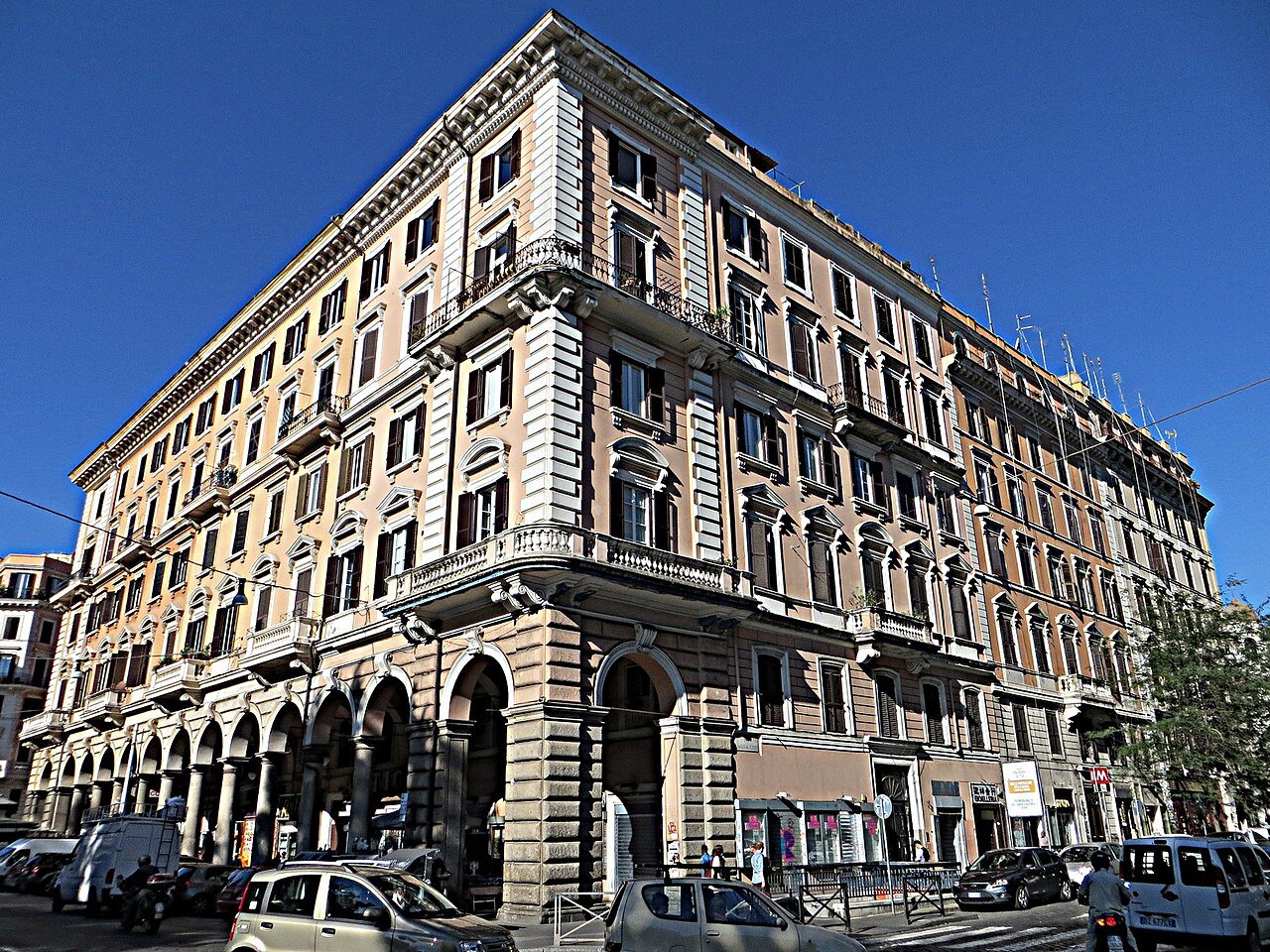 A grand arcaded apartment block on Piazza Vittorio Emanuele II