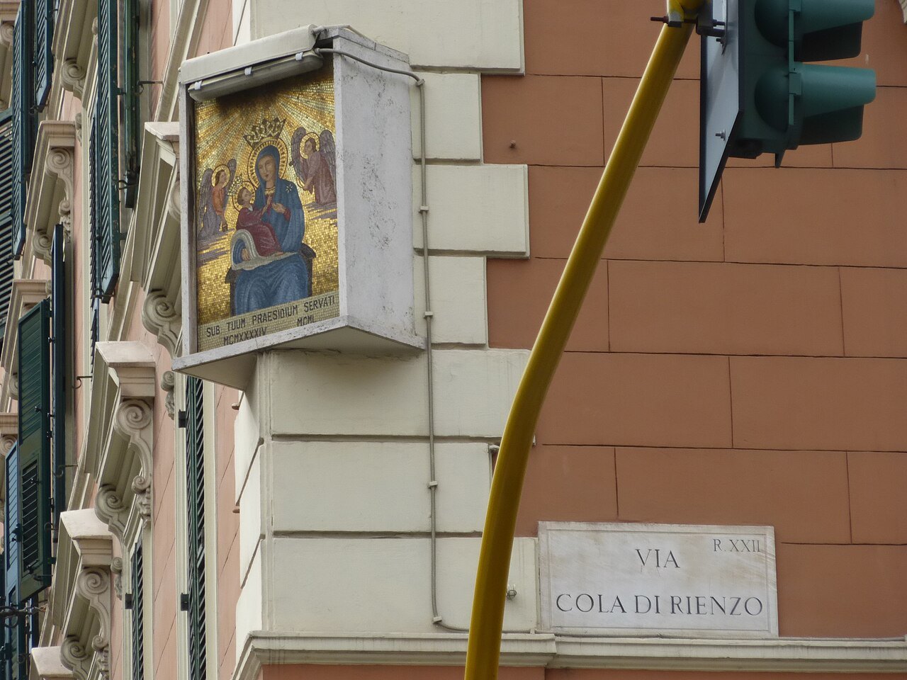 A painted shrine of the Madonna on a wall at the corner of Via Cola di Rienzo