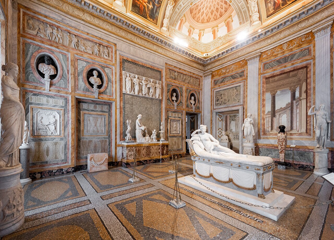 Canova's reclining Pauline Borghese in the middle of a marbled room of the Borghese Gallery