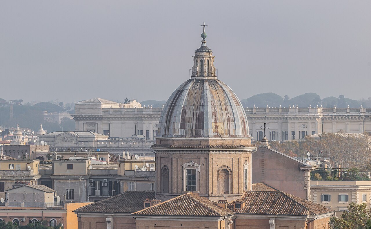 The dome of San Giovanni dei Fiorentini above the rooftops by the Tiber