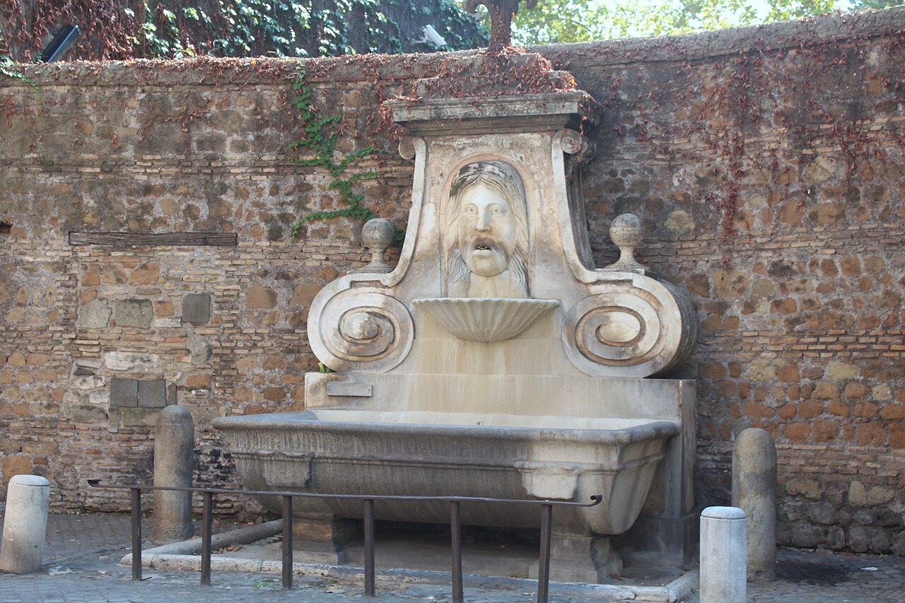 The Fontana del Mascherone on Via Giulia, water running from a great stone mask