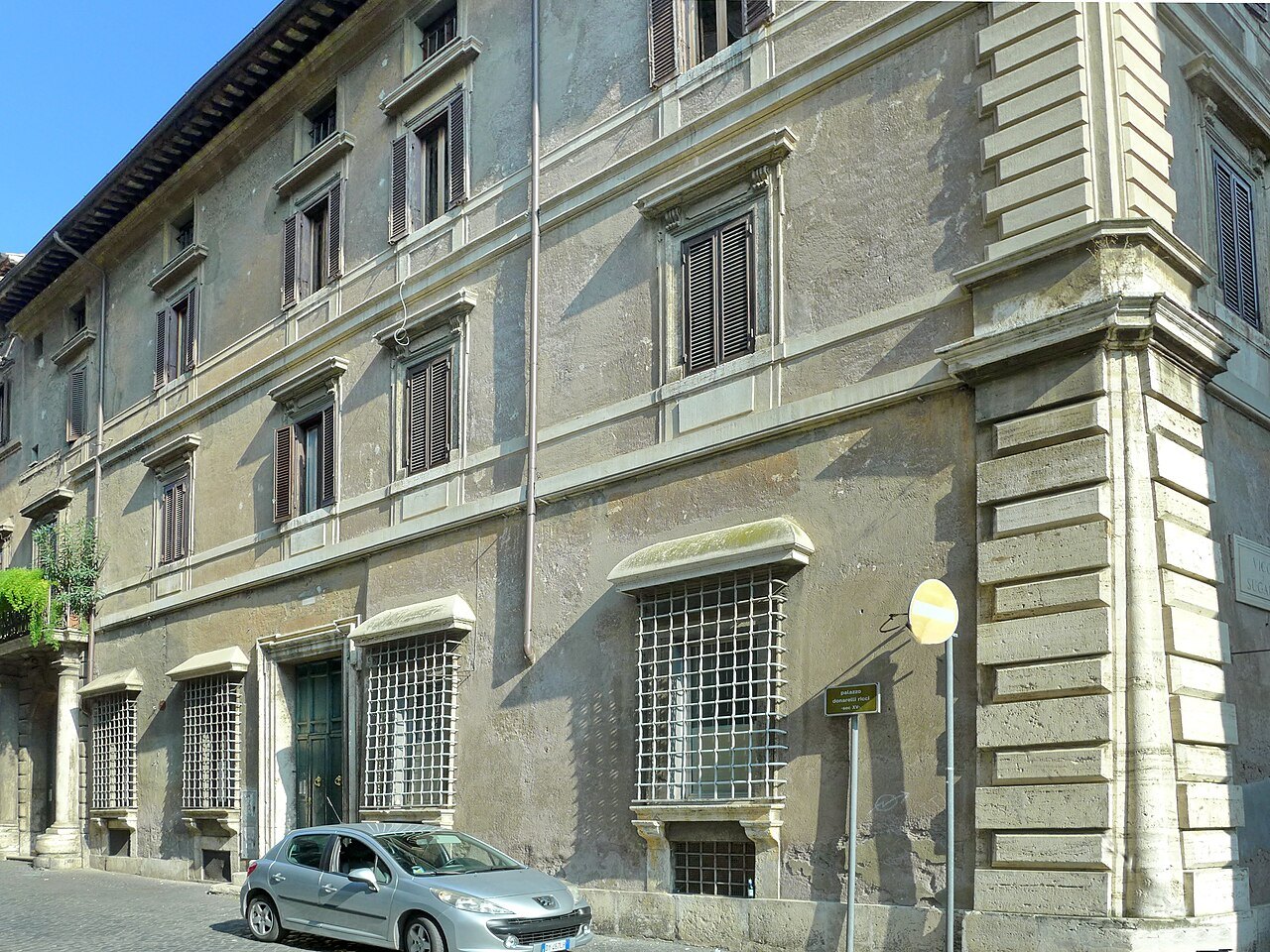 The rusticated corner and barred windows of a Renaissance palace on Via Giulia
