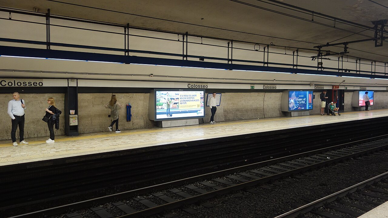 The platform of Colosseo station on Metro line B, a few passengers waiting