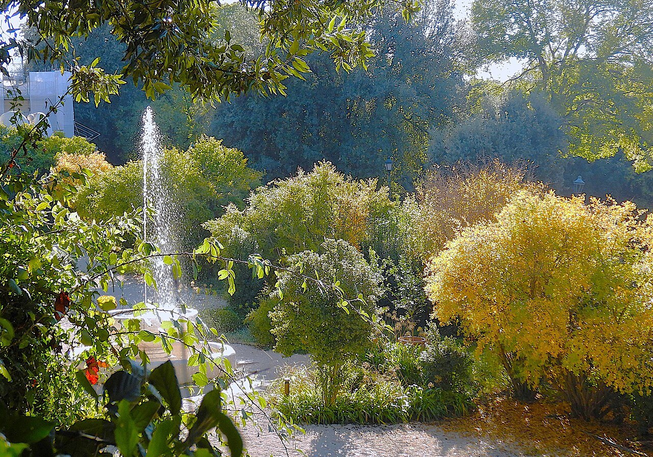 A fountain among autumn shrubs in the secret garden of the Villa Borghese