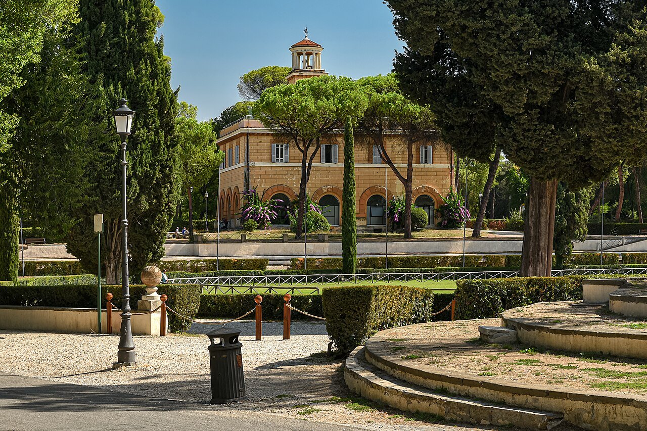 The Casina dell'Orologio with its clock tower among pines in the Villa Borghese