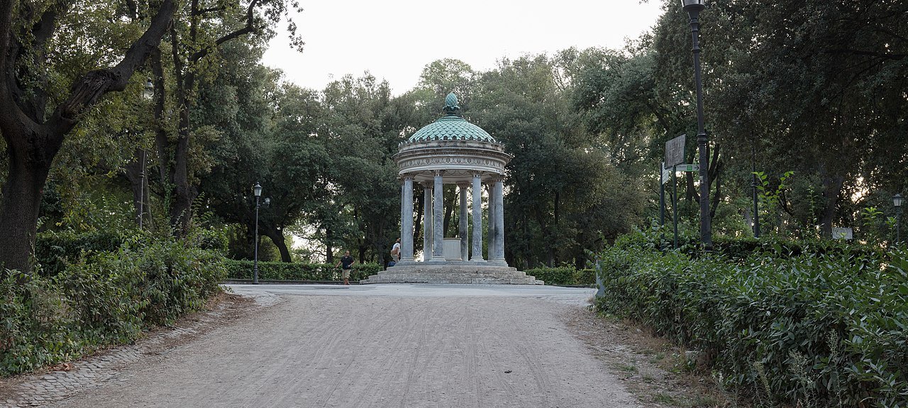 The small round Temple of Diana among the trees of the Villa Borghese