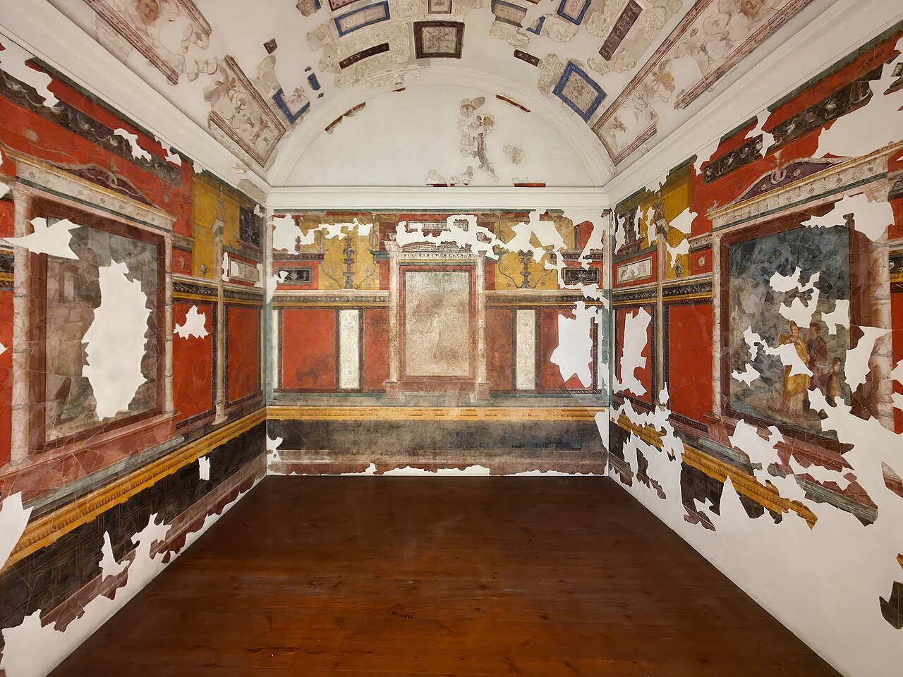 A room in the House of Augustus on the Palatine, its walls painted red with columns and panels