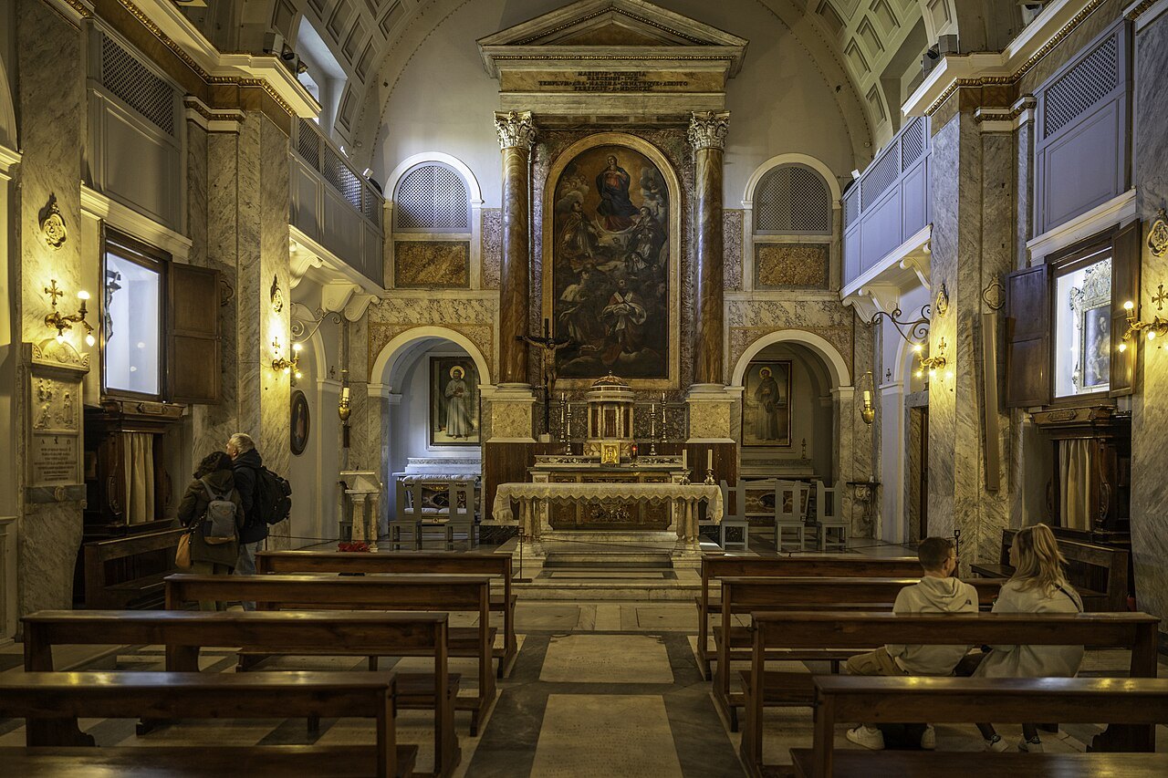 The interior of the small church of San Bonaventura on the Palatine, its altar and pews