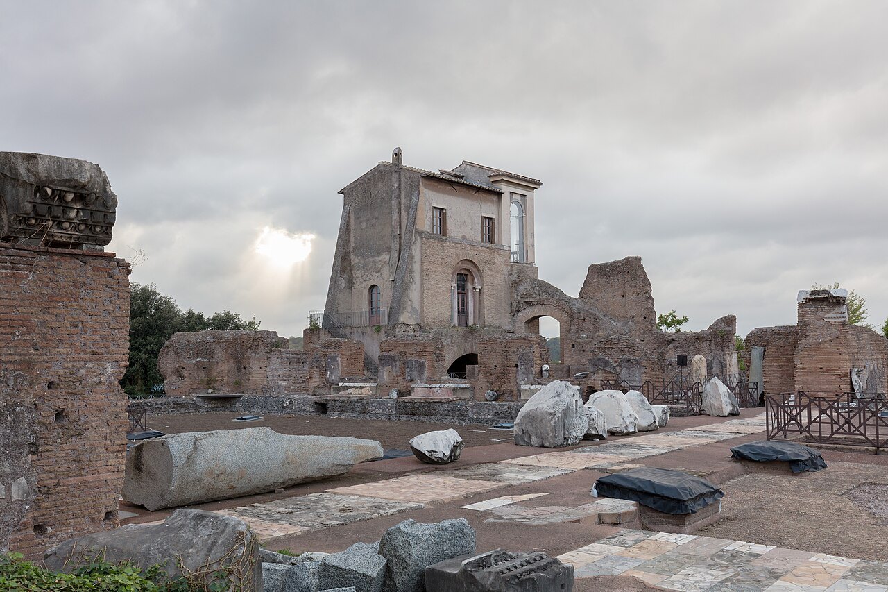 Broken columns and marble fragments on the Palatine, brick ruins behind