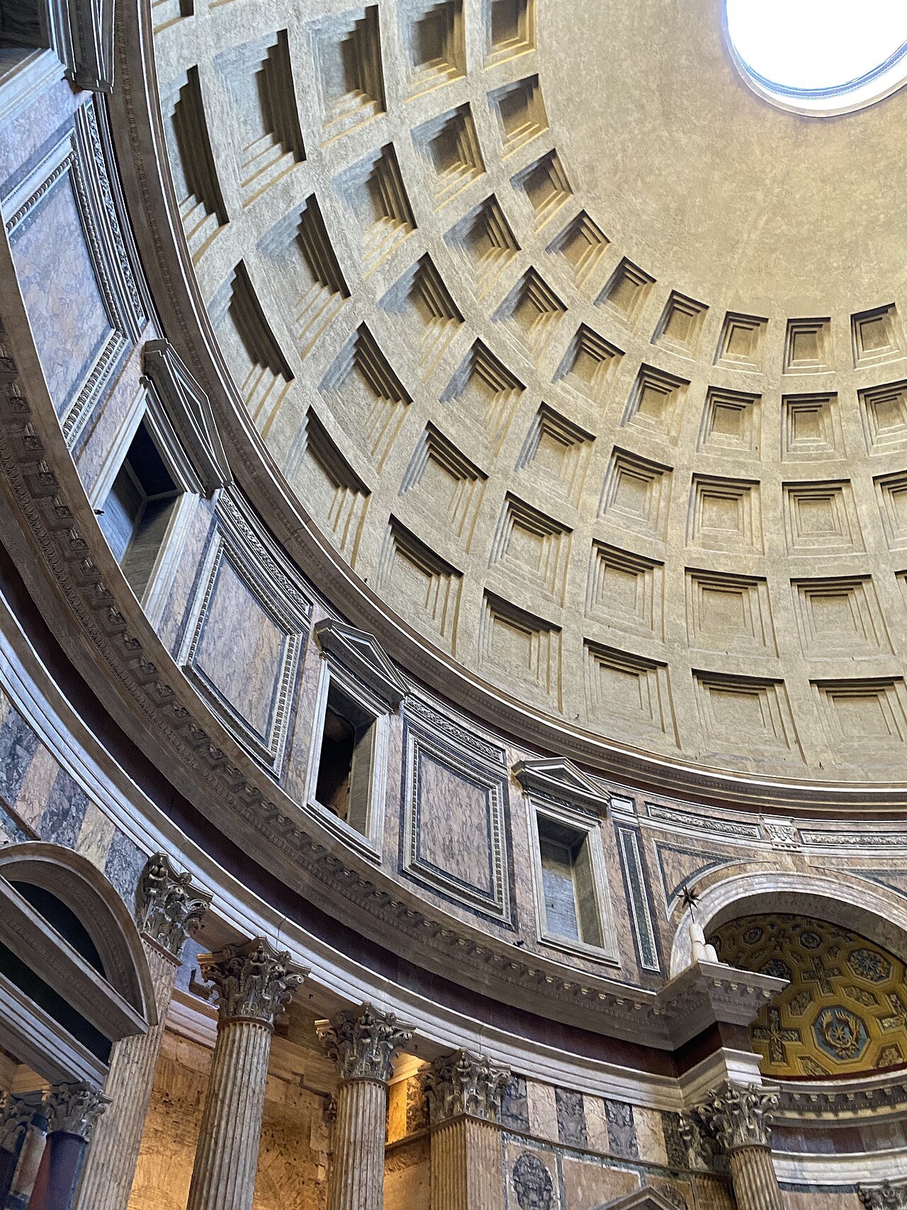 Looking up inside the Pantheon at the rings of coffers and the round oculus