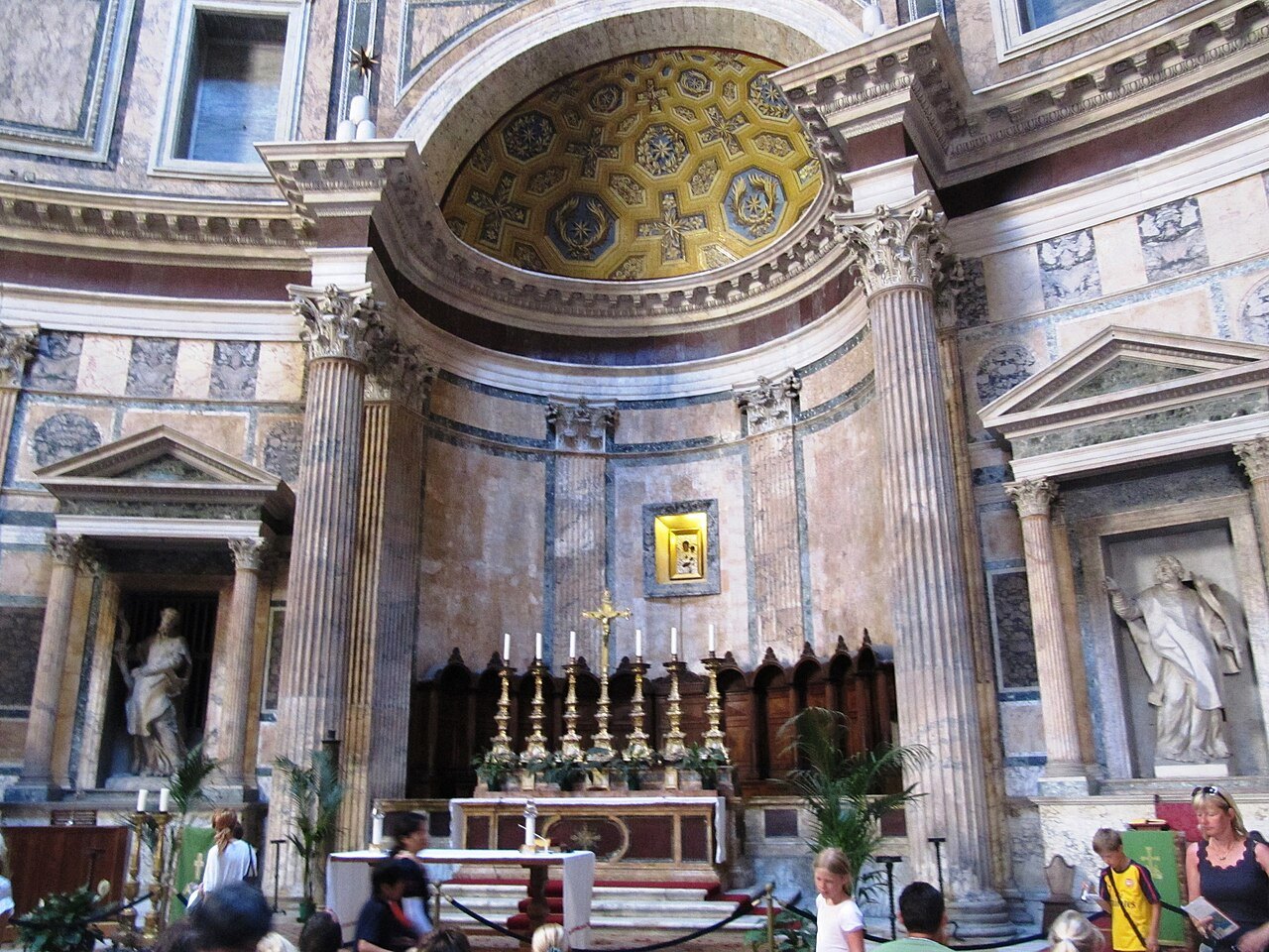The high altar of the Pantheon in its apse, a gilded mosaic in the half-dome above