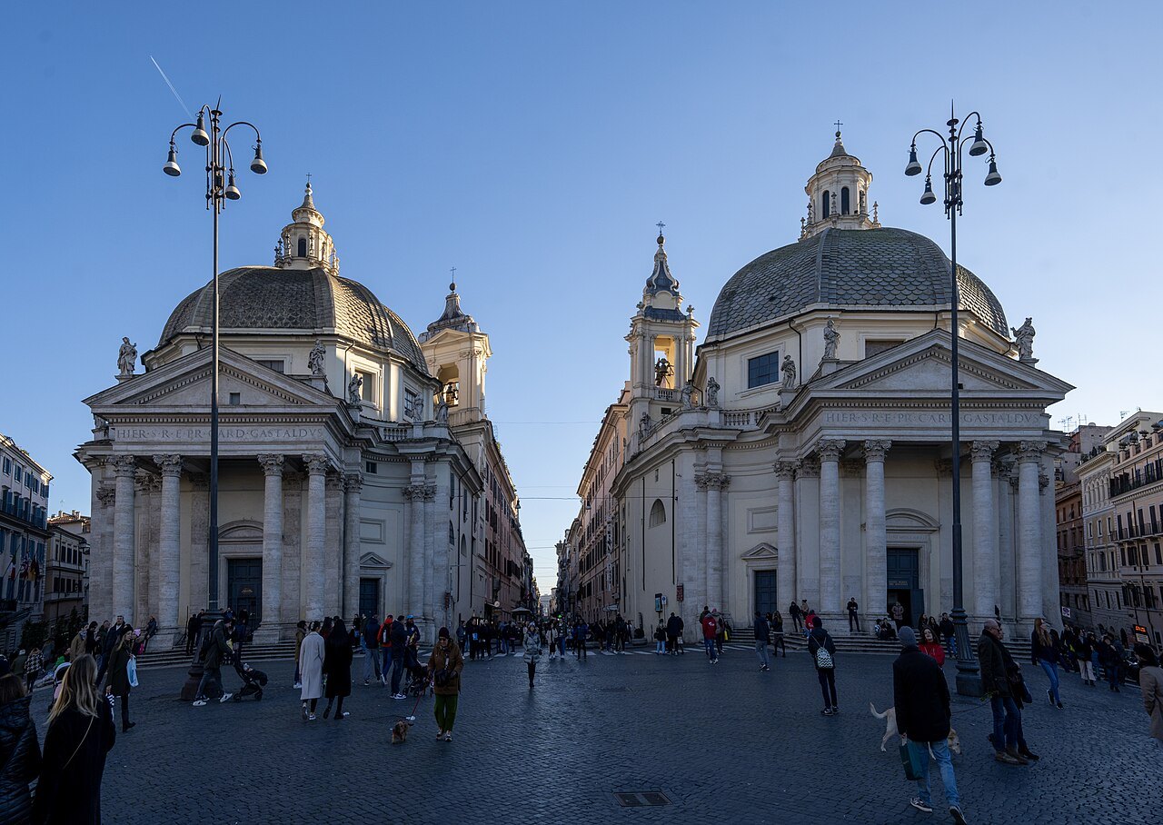 The twin domed churches of Santa Maria dei Miracoli and Santa Maria in Montesanto at dusk