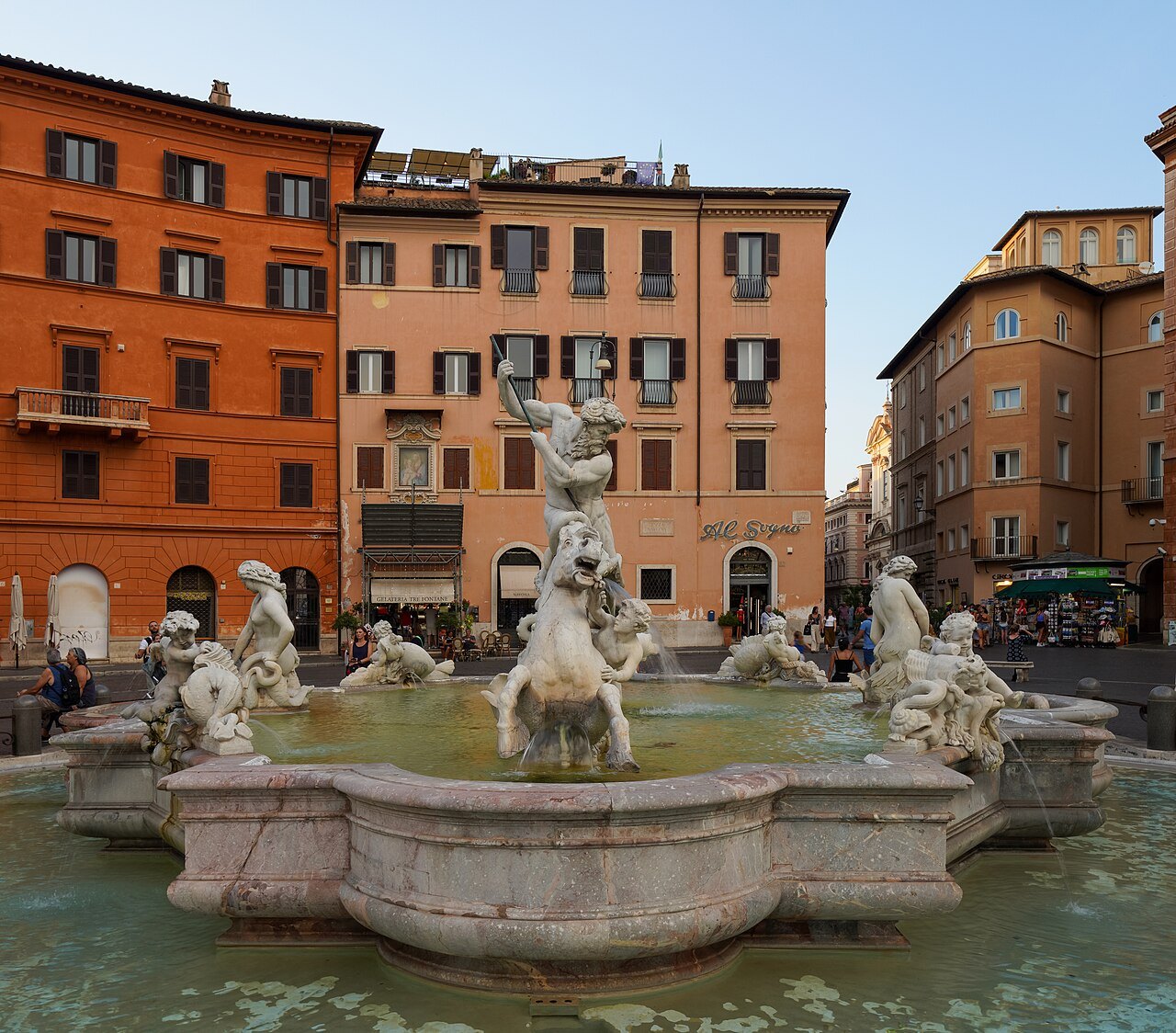 The Fountain of Neptune at the north end of Piazza Navona, red and ocher houses around it