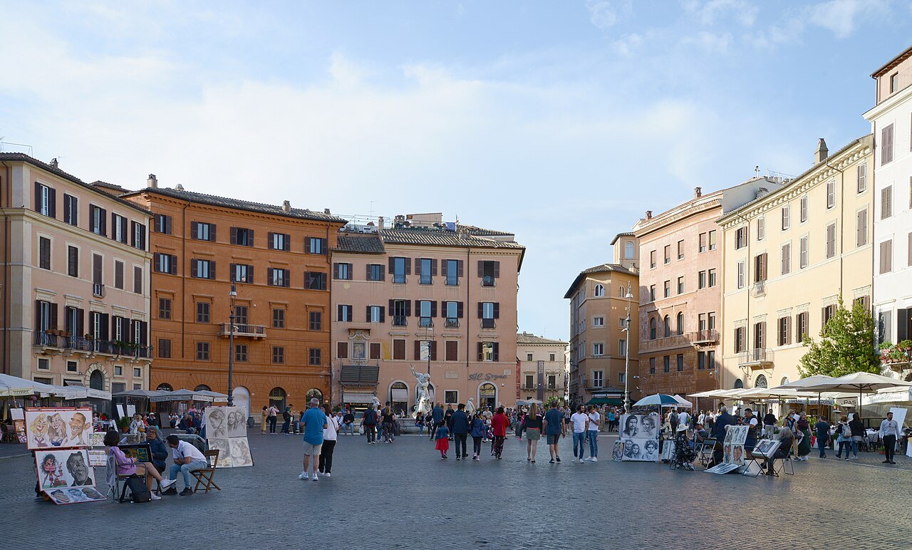 The painted house fronts of Piazza Navona, artists' stalls along the square