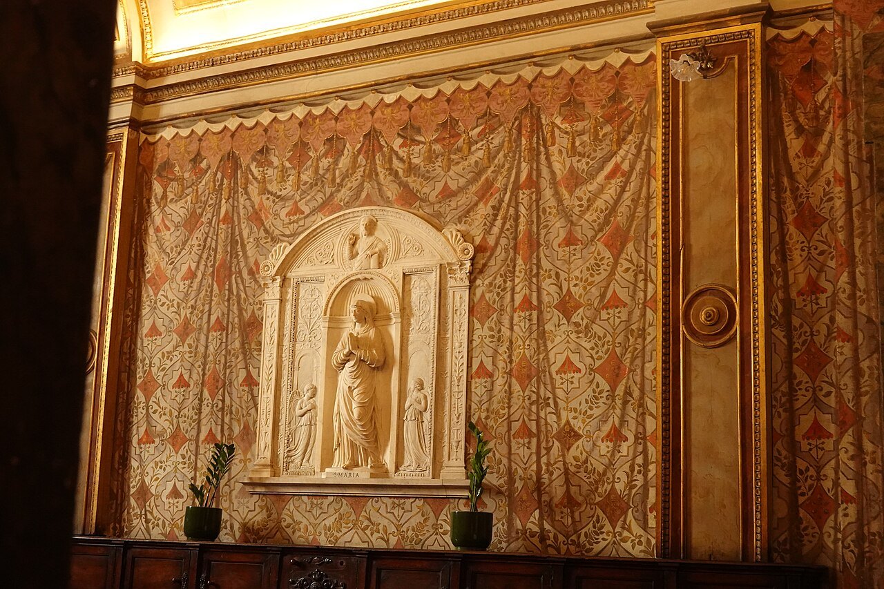A carved and draped altar niche inside Santa Maria Maggiore