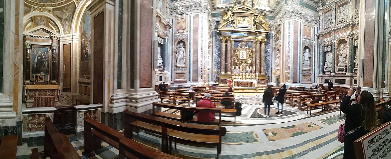 A side chapel of Santa Maria Maggiore, its altar in colored marble and gilt