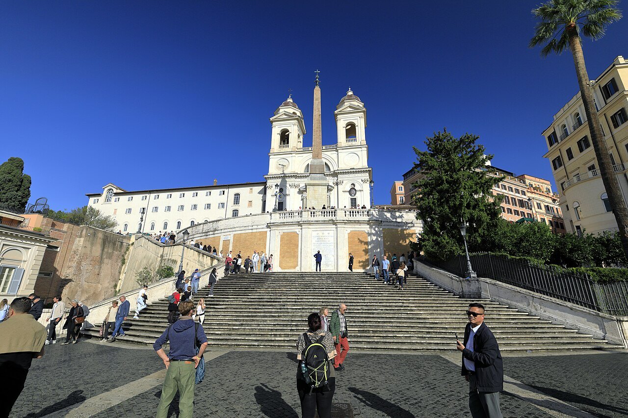 The Spanish Steps from the square, the two towers of Trinità dei Monti above the flights