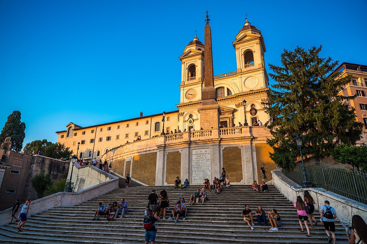 The Spanish Steps in golden evening light, the church of Trinità dei Monti at the top
