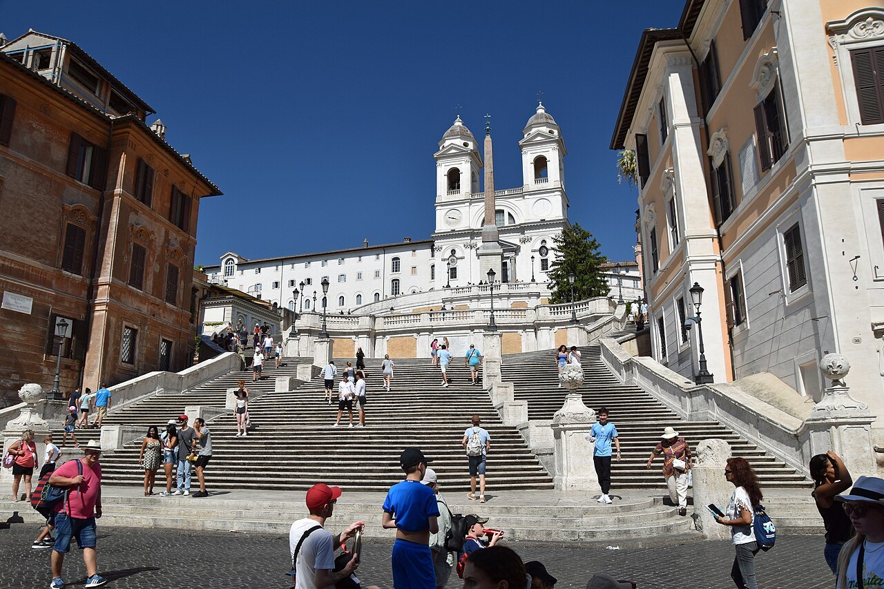 The Spanish Steps crowded on a sunny day, Trinità dei Monti at the top