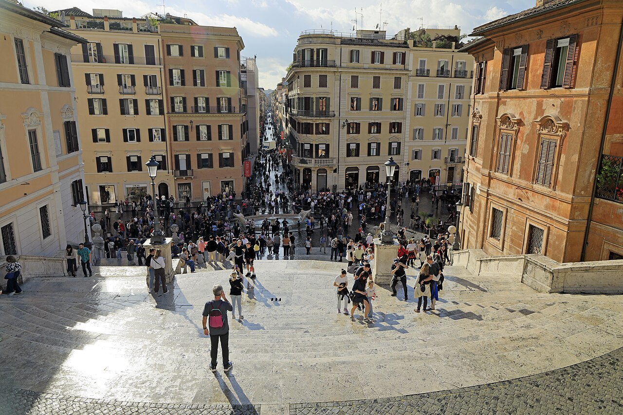 Via dei Condotti from the top of the Spanish Steps, crowds in the square below