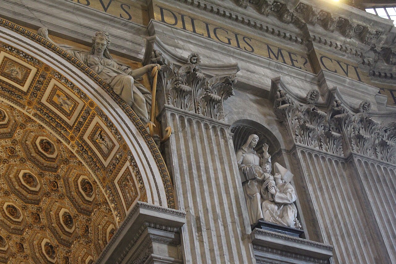 Statues and carved inscriptions high inside St. Peter's Basilica