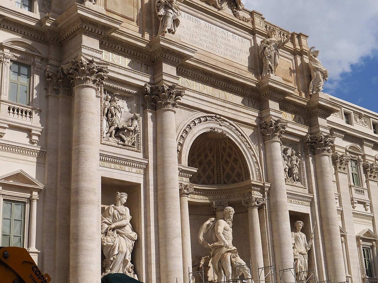 Columns and statues of the Trevi Fountain's façade seen close from below