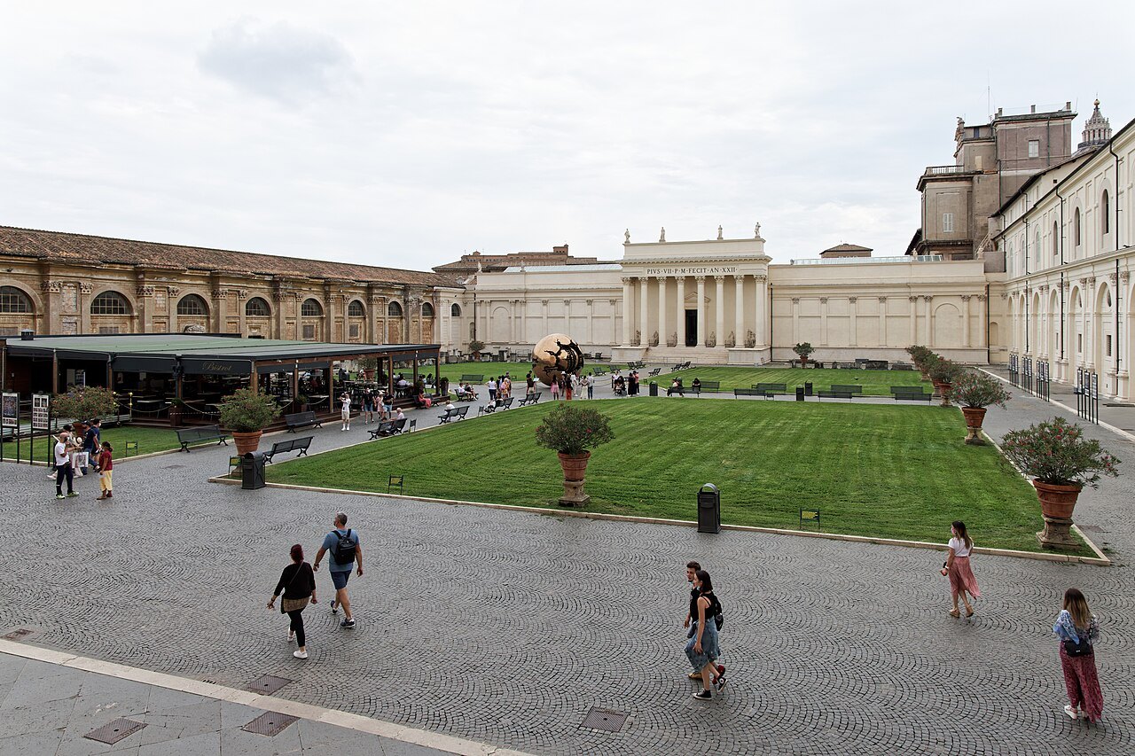 The Cortile della Pigna in the Vatican Museums, a lawn and potted trees before the great niche